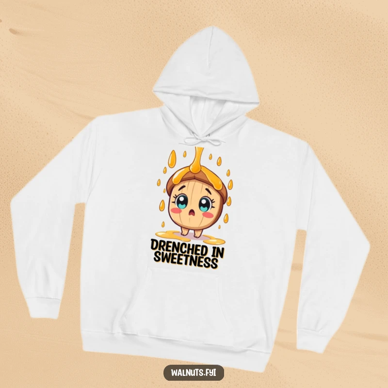 Funny tan pecan character, wide-eyed and surprised, gets drenched in syrup on this cozy hoodie.