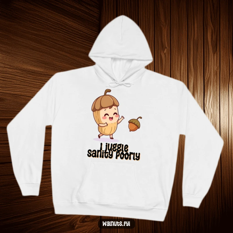 Funny hoodie with a playful walnut character juggling a small acorn, cozy and humorous apparel.