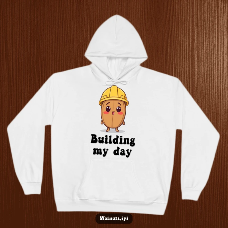 Funny hoodie showing a surprised walnut character wearing a miniature construction helmet and looking up.