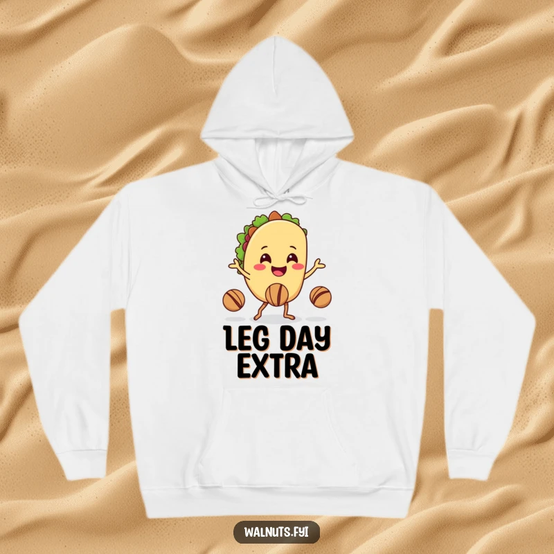 Funny hoodie depicting a happy taco character juggling walnuts with its legs, offering warmth and humor.