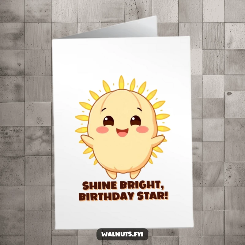 Funny Free Printable Birthday Card: Golden Macadamia Nut character beaming with a radiant smile, sharing a warm, glowing light.