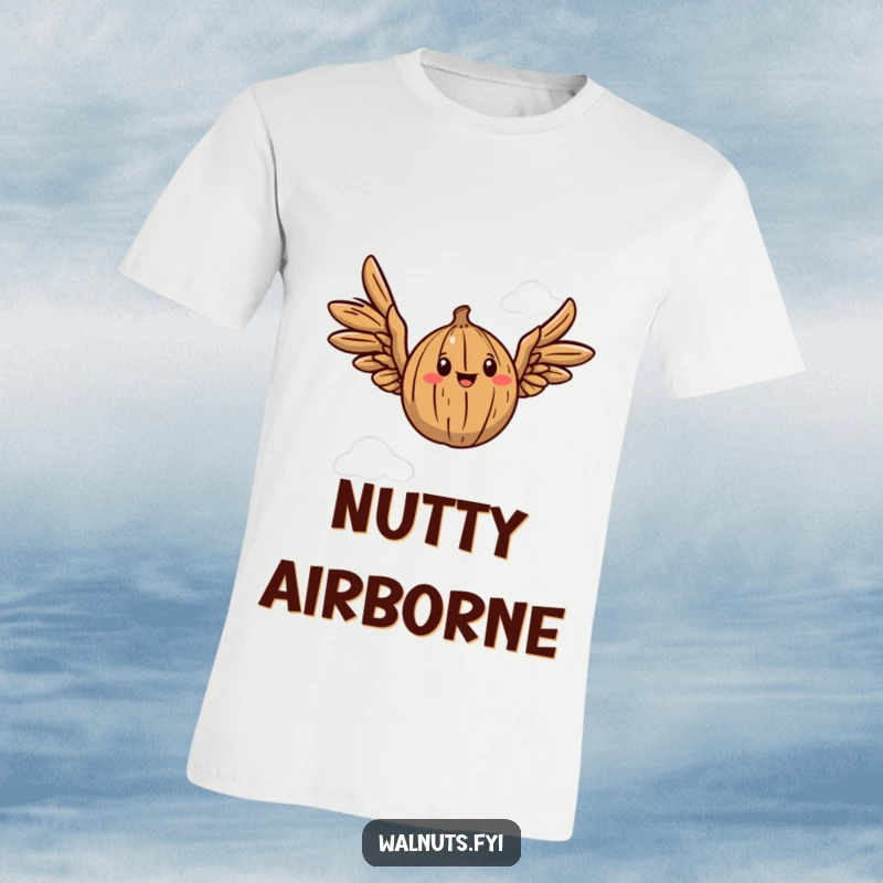 Funny T-Shirt showing a walnut with playful wings soaring through the air, symbolizing joy and movement.